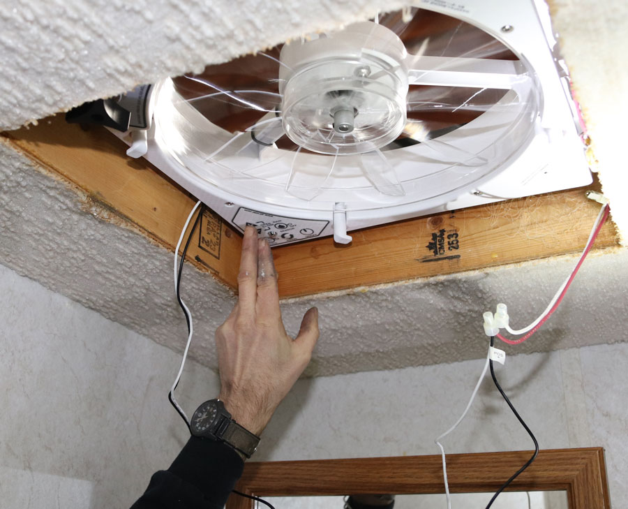 Back down below, wire the fan according to the directions and test