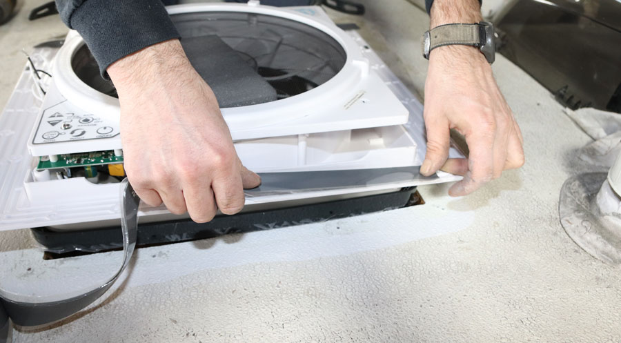 Apply sealant tape to the flange around the inverted fan. The technician at Tim’s RV used double-sided EternaBond tape, but regular butyl tape will work also. Make sure the tape goes all the way around