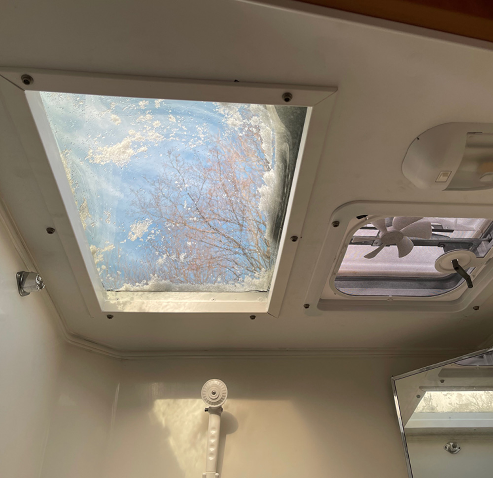 view of skylight in RV bathroom