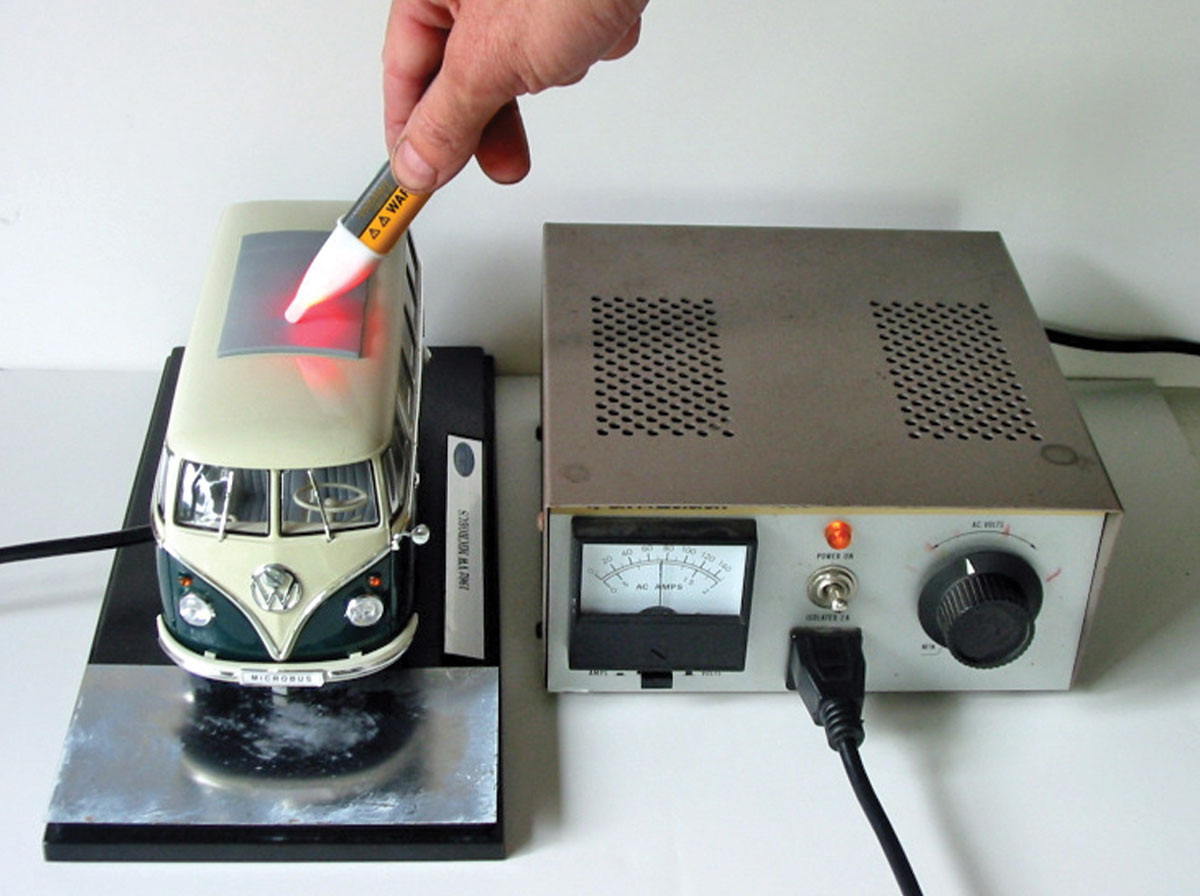 non-contact voltage tester (NCVT) firmly in hand