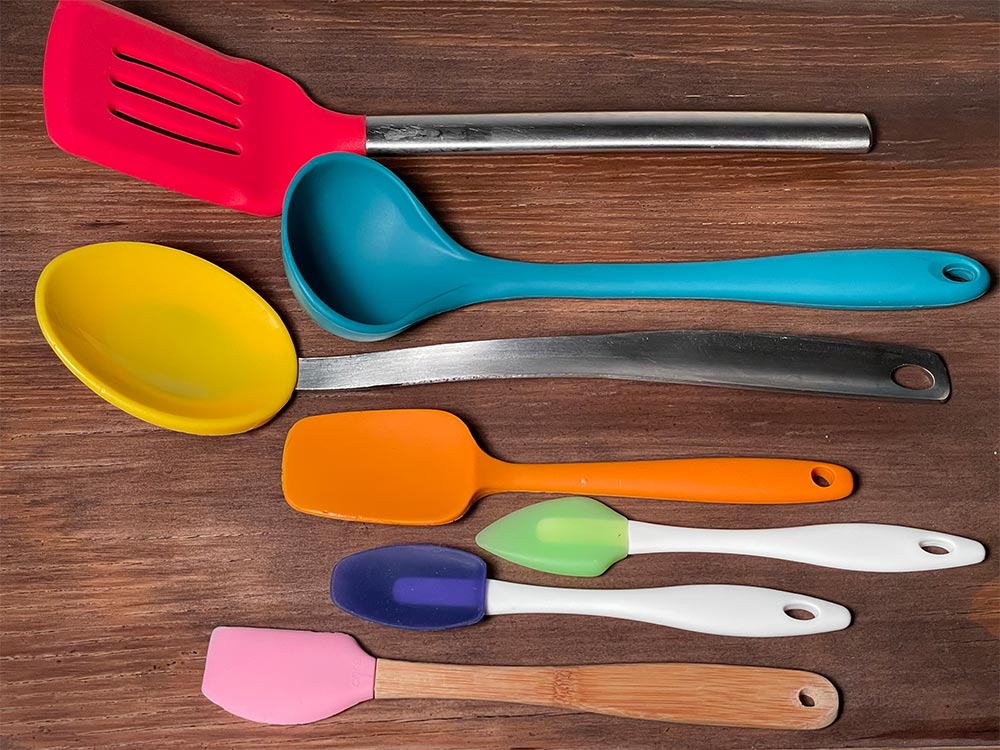 Spatulas, Scrapers, Spoons & Whisks set on table