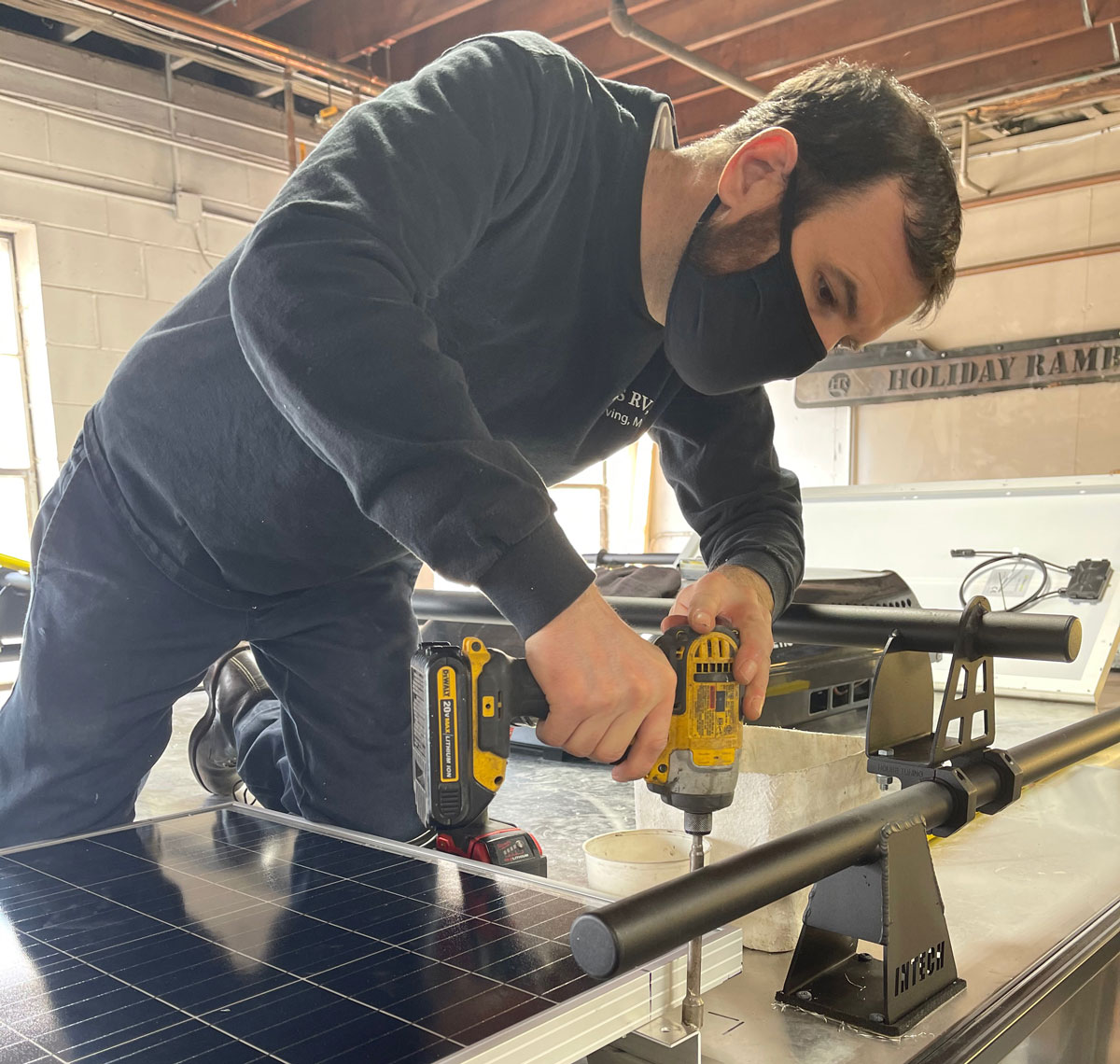 Installing a Bluetooth-monitored  320-watt solar array on a  towable camper/garage