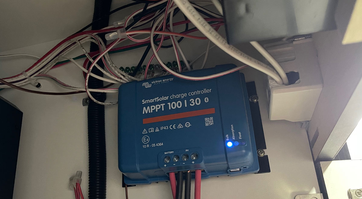 Once completed, the Victron SmartSolar charge controller is tucked up out of the way and fully functional.
