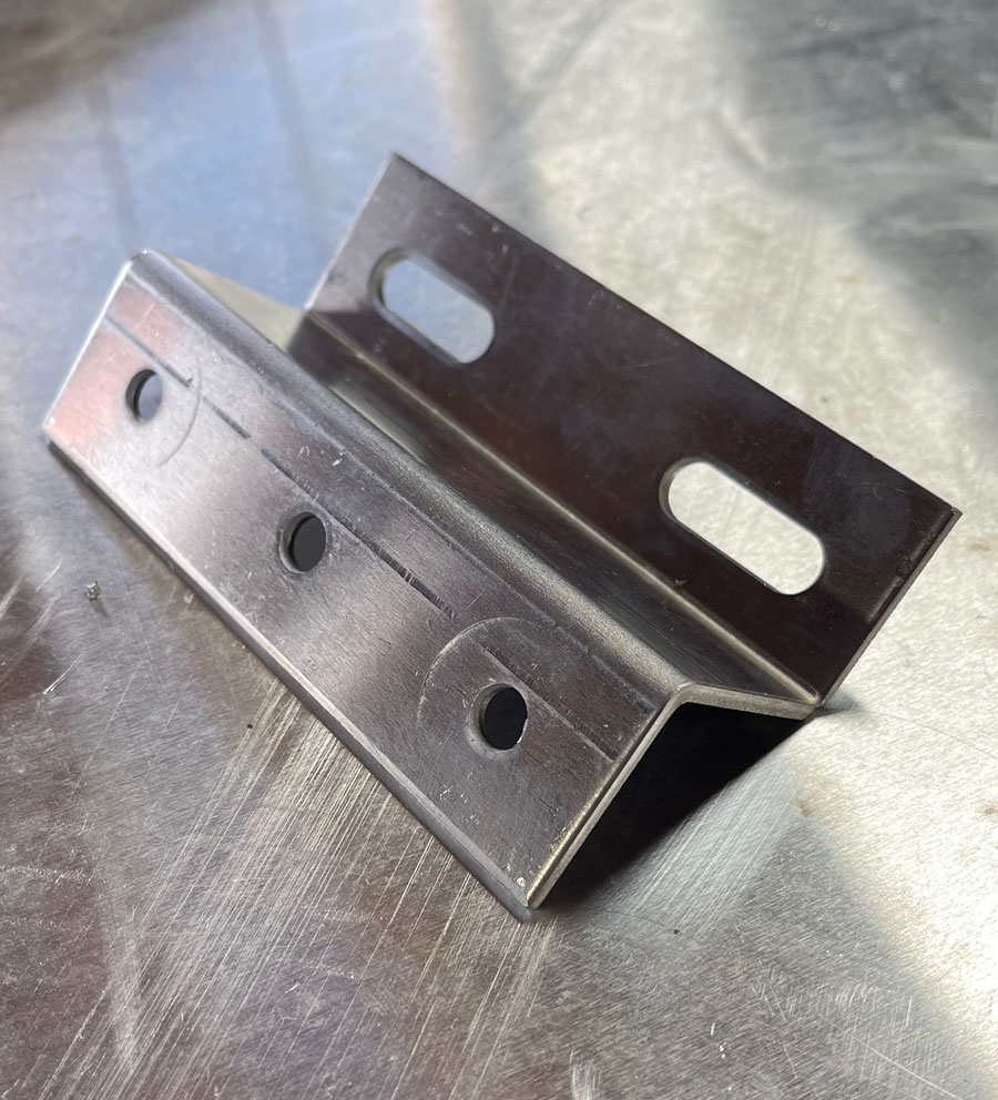 Z-brackets were purchased to mount the solar panels. The brackets and hardware were modified to make them easier to install.