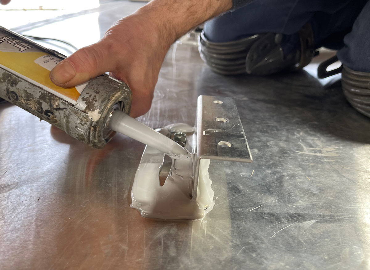 Be sure to use plenty of sealer that’s appropriate for the particular type of roof. Do it right the first time, because the panels are a chore to remove and reinstall, as is resealing the brackets.