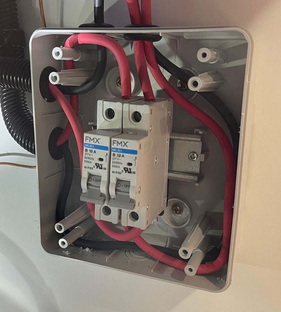 The solar cables were run down from the roof inside the wardrobe and into the utility cabinet. They were then fed into the solar circuit breaker box, then back up to the solar charge controller.