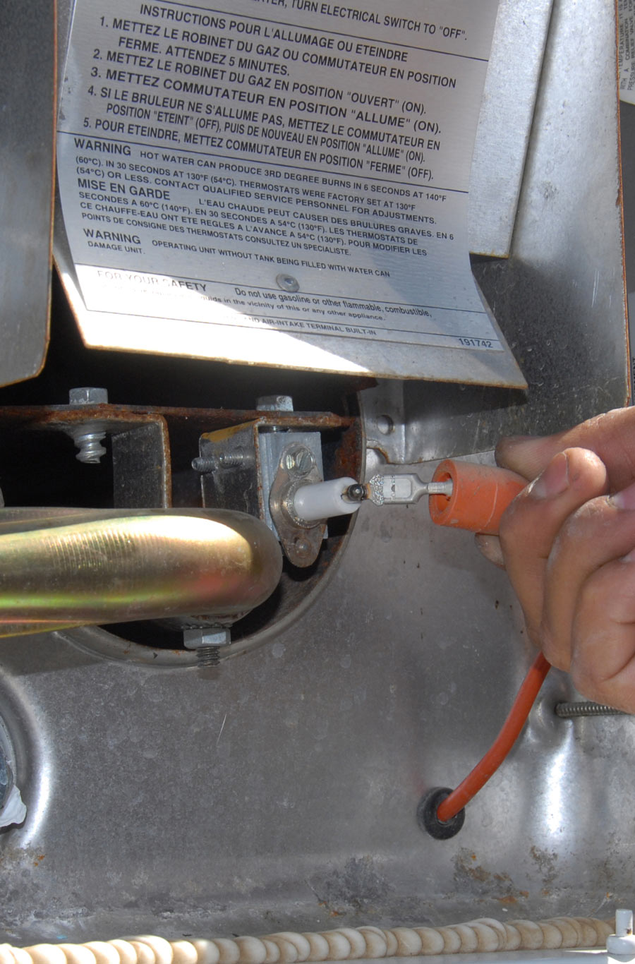 unplugging electrode wire from water heater