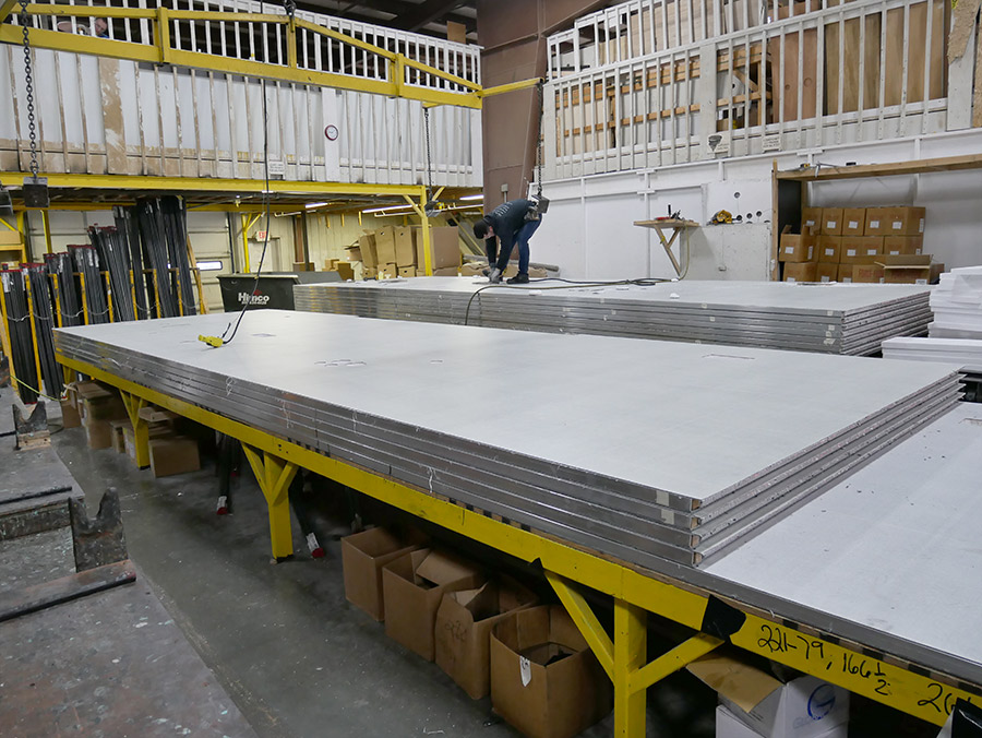 a laminated composite “sandwich” of two exterior polypropylene layers