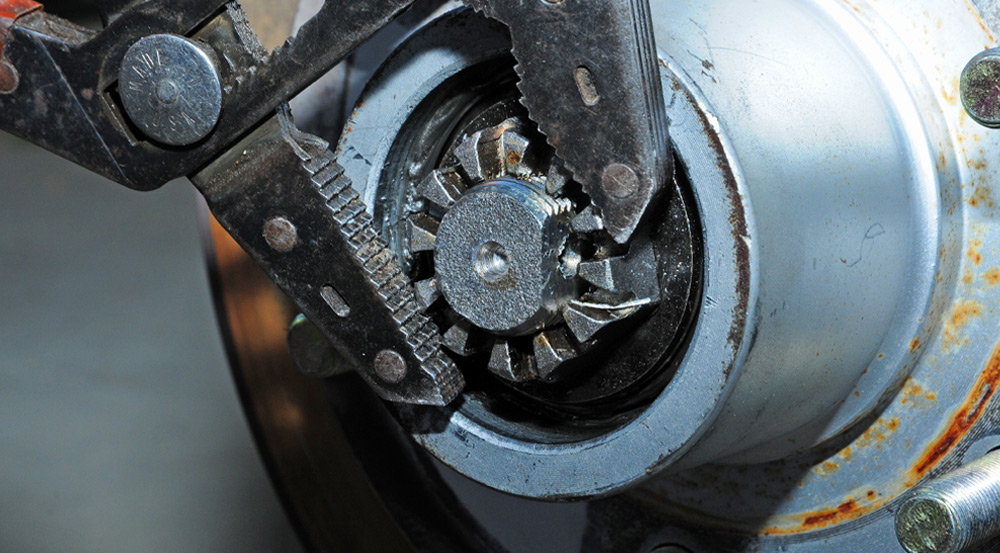 the castle nut is removed from the axle spindle