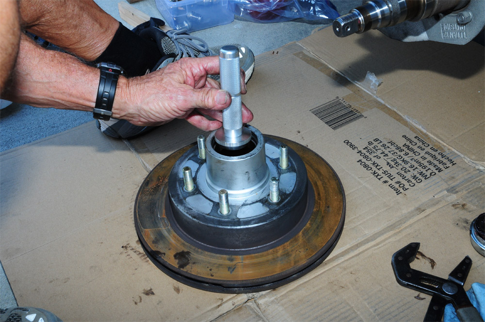 mechanic removes inner bearing