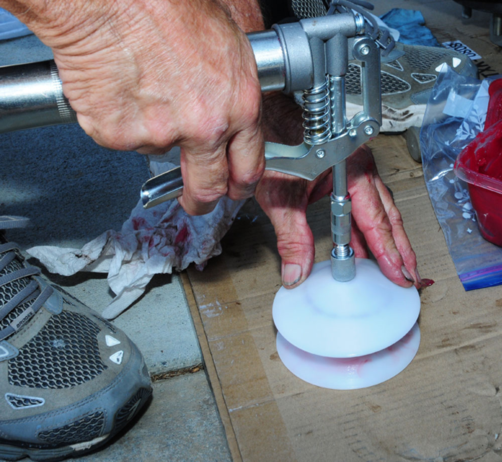 grease gun presses grease into the bearing