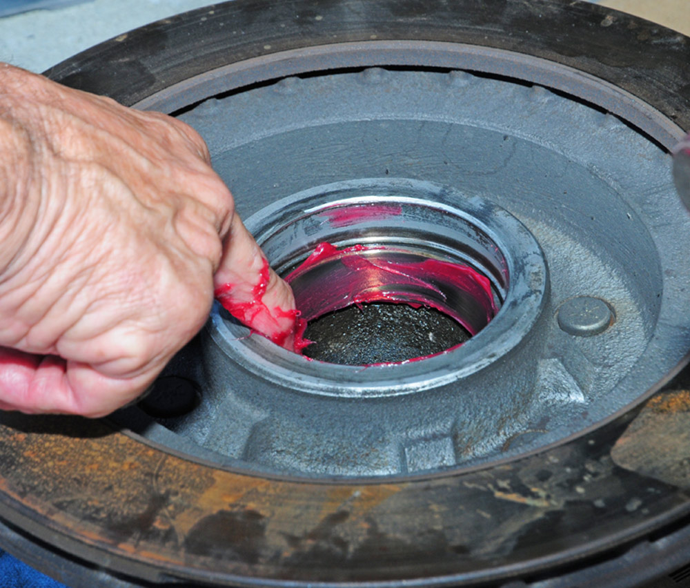 a thin layer of grease is applied to the inner and outer cups inside the hub