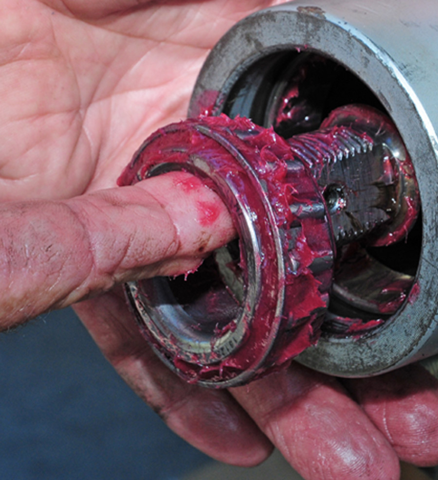 mechanic inserts the outer bearing straight