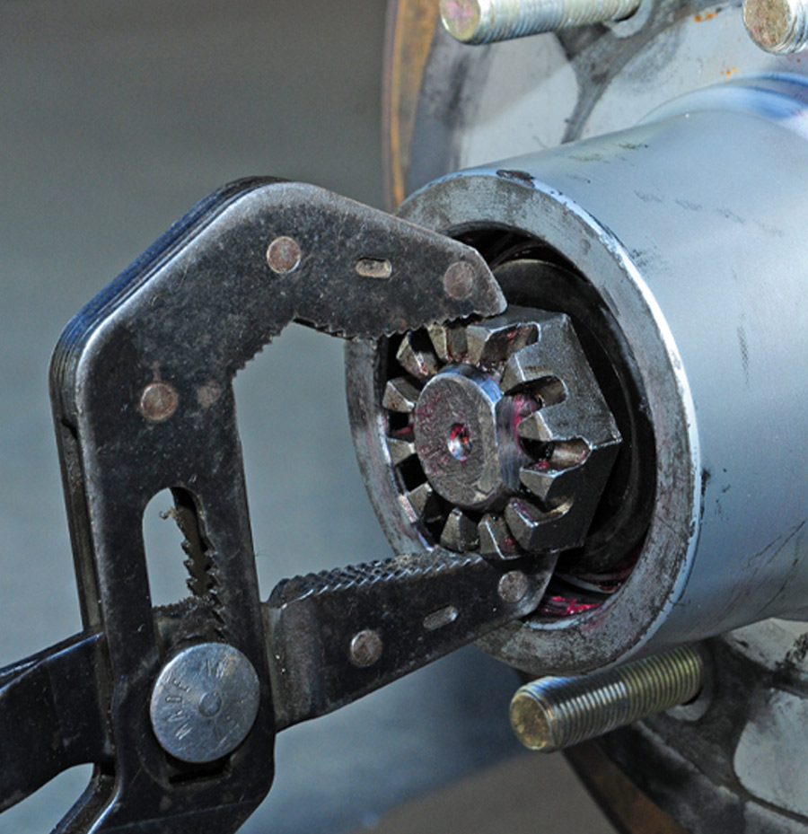 castle and nut are loosened and tightened to ensure correct seating