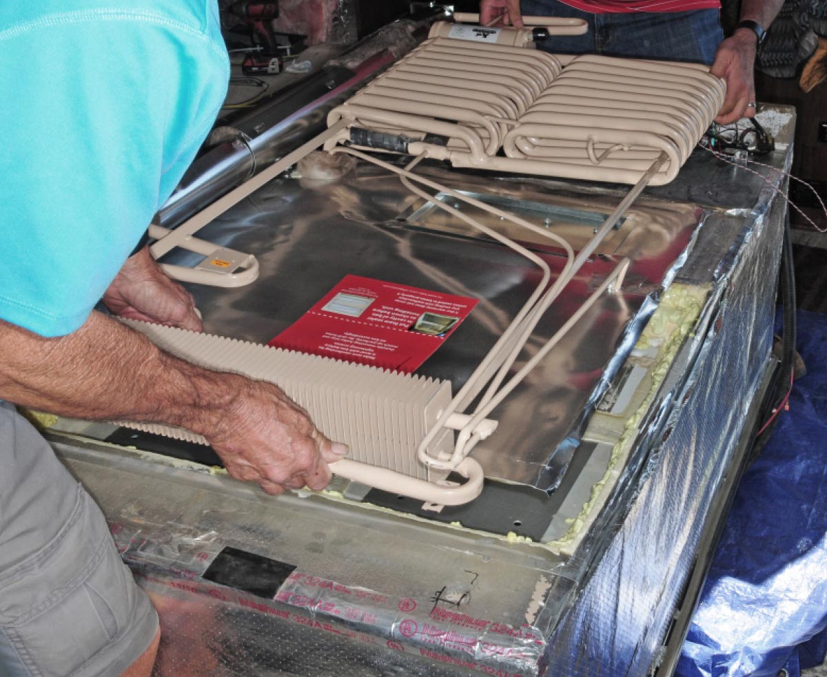 place the cooling unit into the refrigerator cabinet
