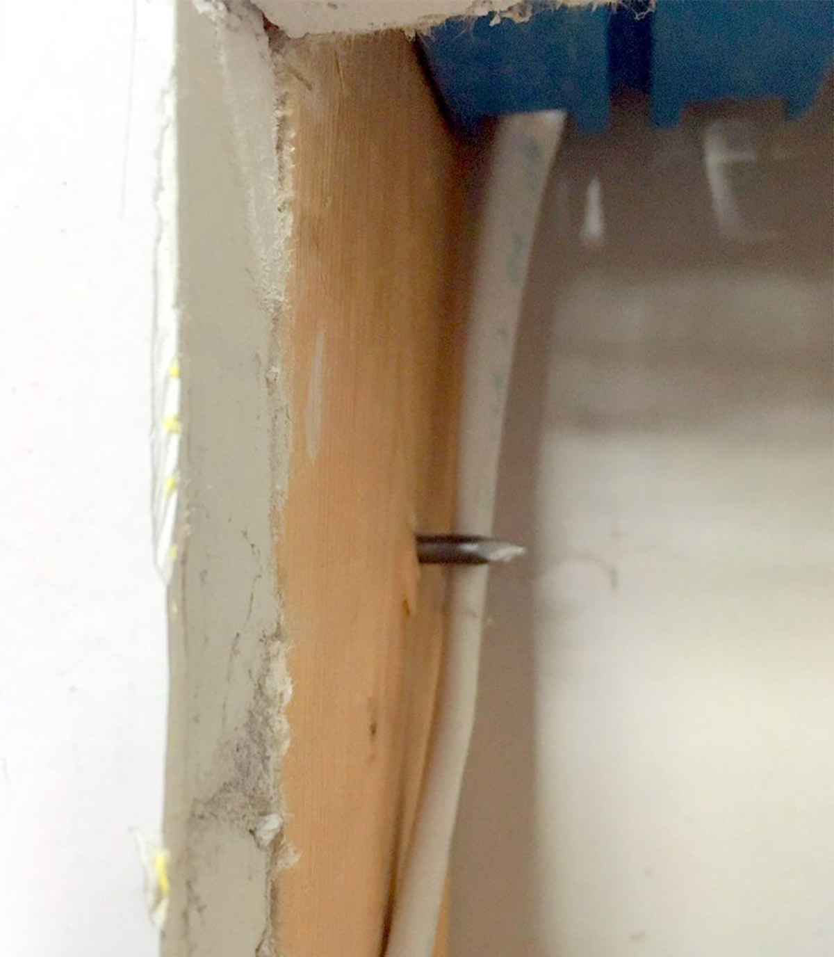 Looking at a nail that was hammered close to a wire