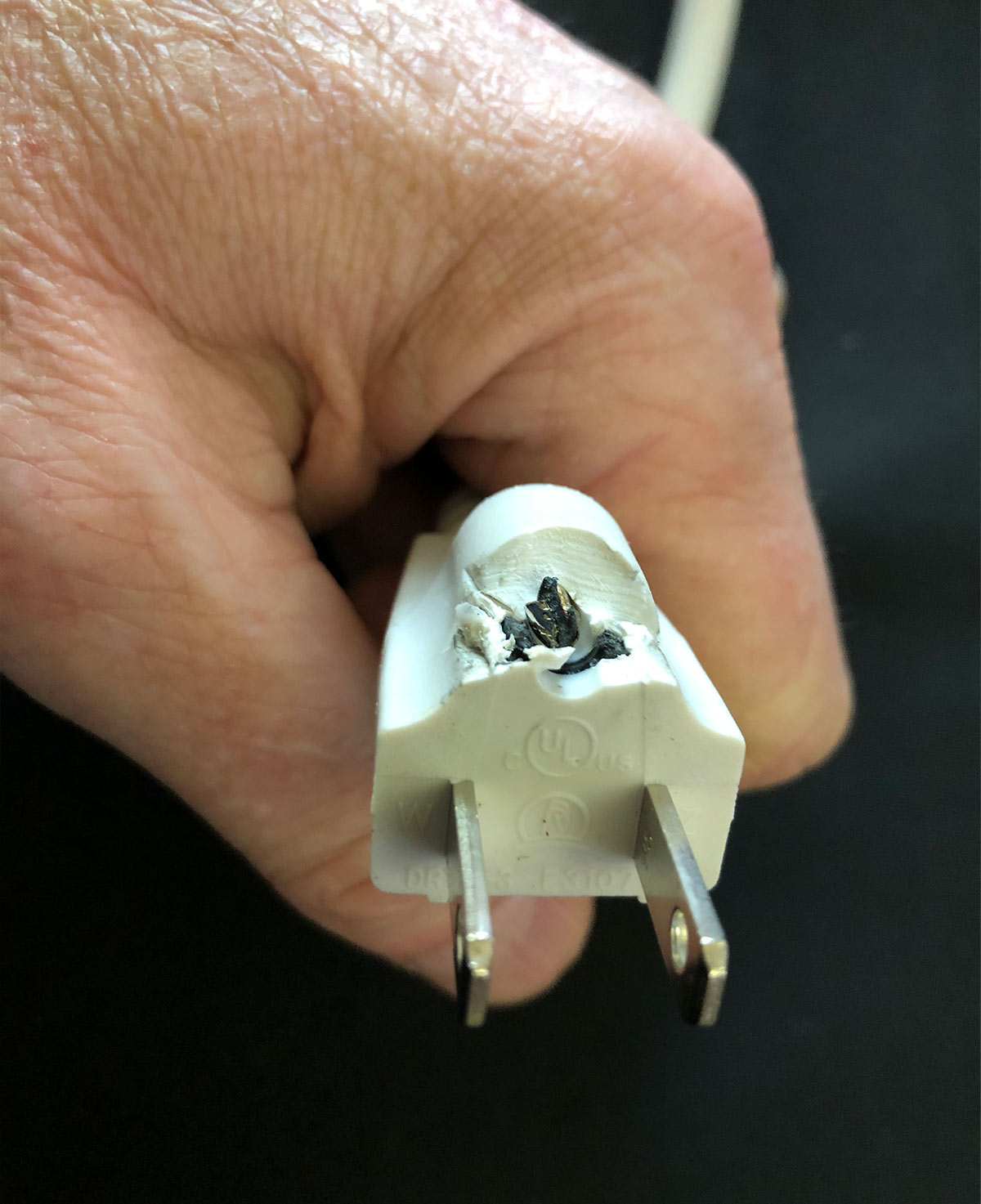An extension cord with it's ground pin cut off