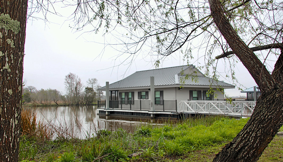 A recently-constructed cabin floating on the bayou at Bayou Segnette State Park
