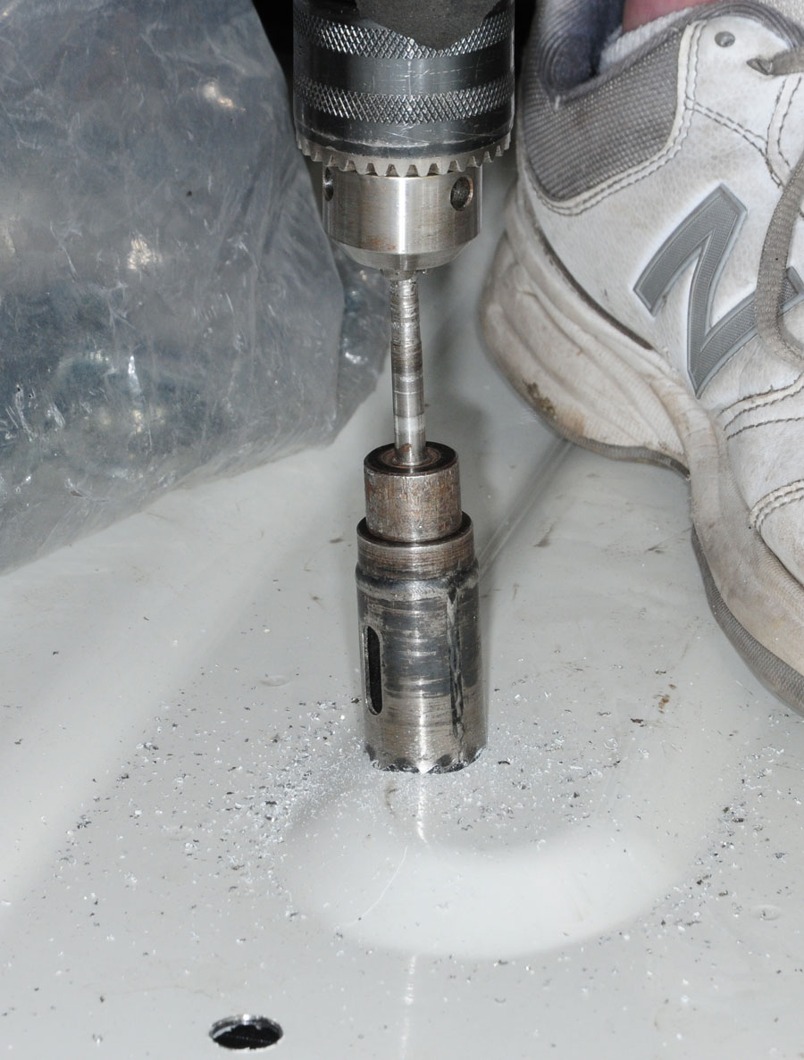 A 1 1/8-inch hole must be drilled through the truck bed (only) to allow the 4-inch base rail bolt to pass through the bottom of the cross sill and top of the oblong hole in the rear frame bracket