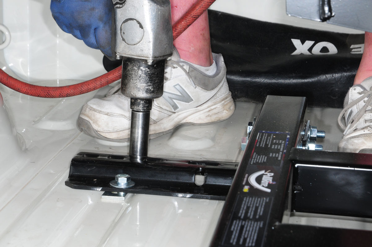 Once the hitch is secure, the truck bed rail and frame bracket bolts are tightened to spec