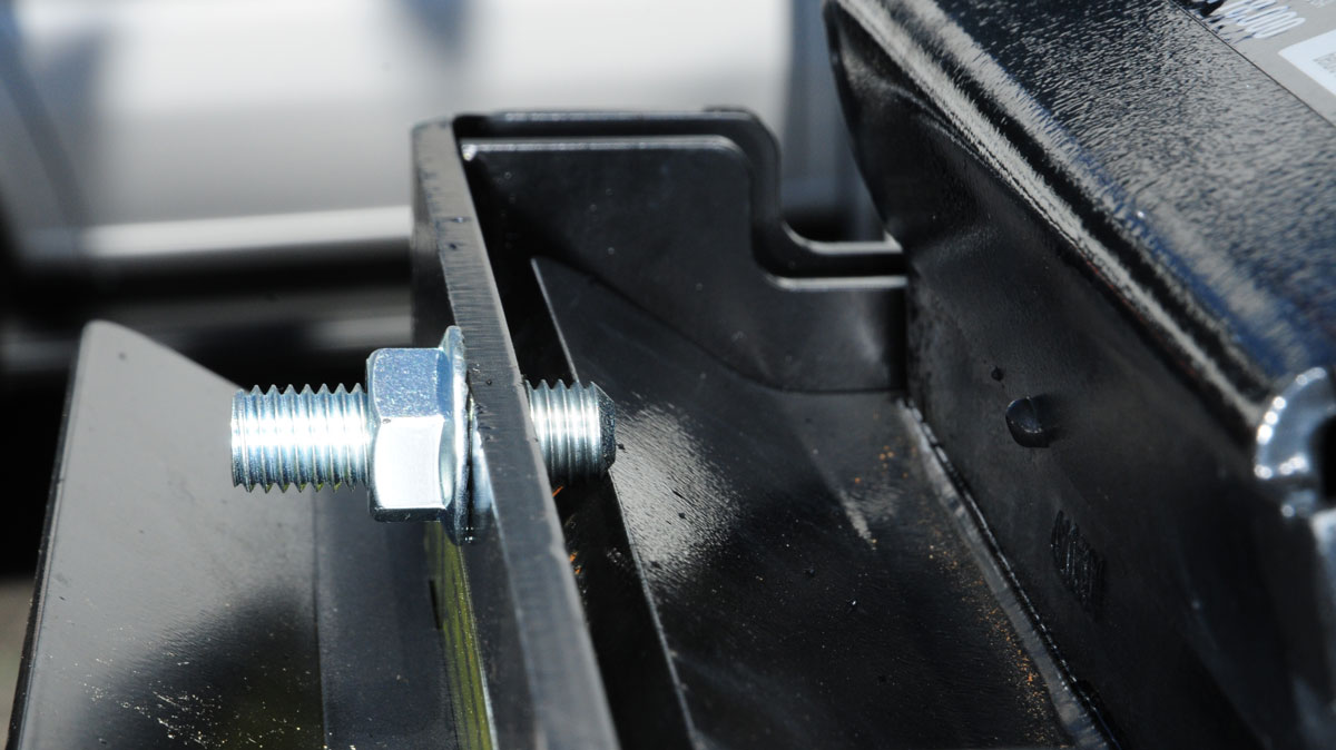 The capture plate is attached to the kingpin box and secured using bolts in the front and back