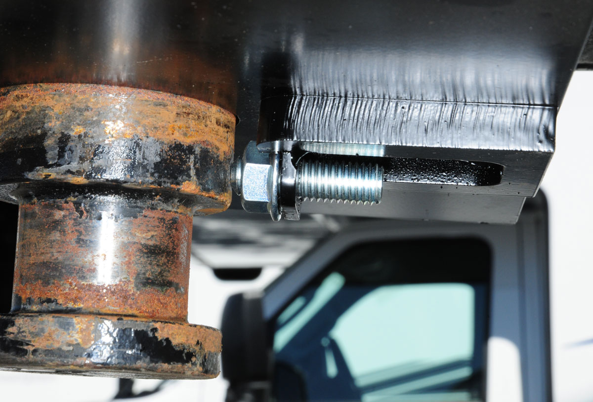 As the truck turns, the plate assembly and turntable roll on the way tubes, pulling the mechanism back enough for the front of the fifth wheel to clear the back of truck cab