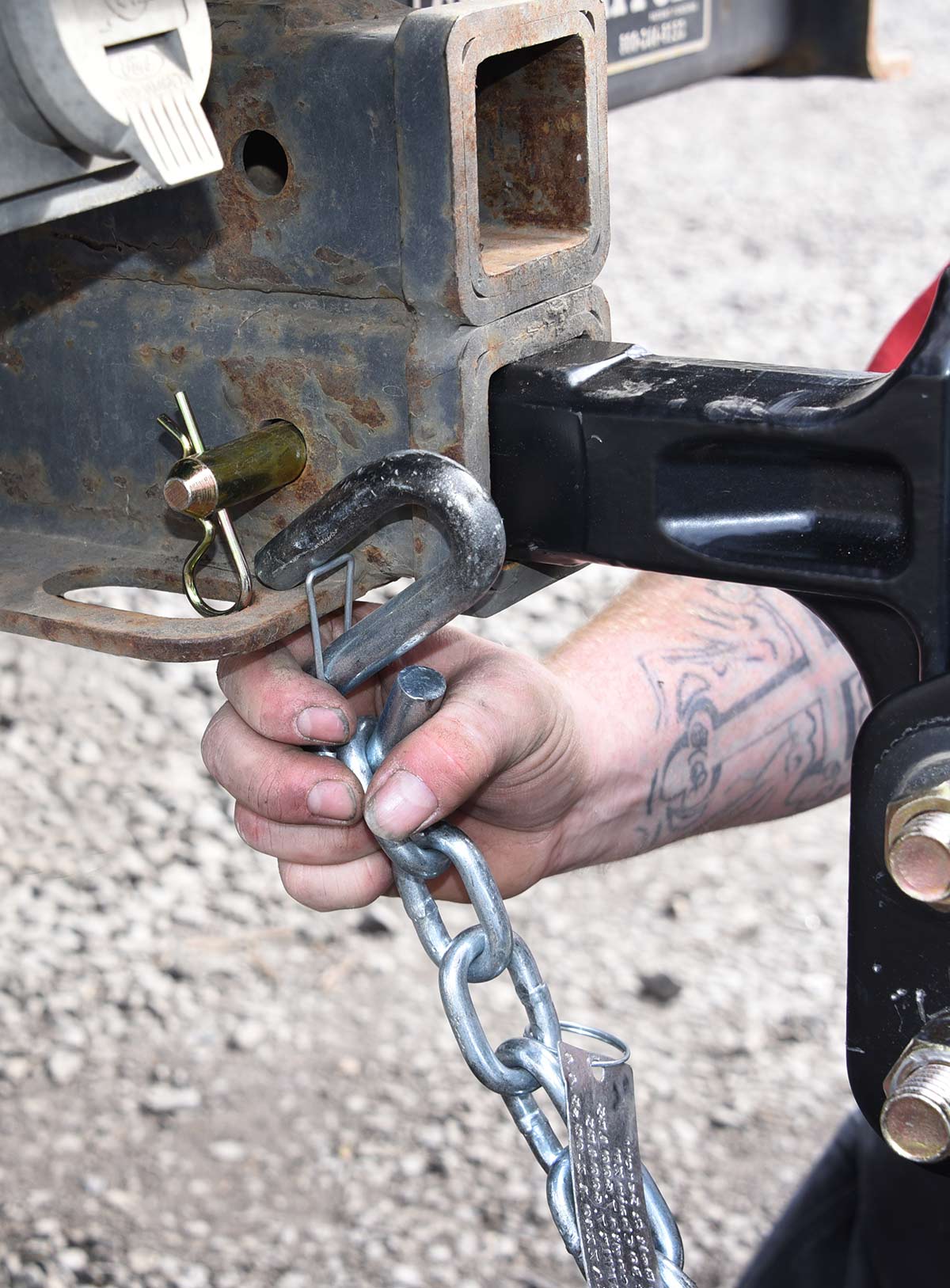 Attach the trailer’s safety chains