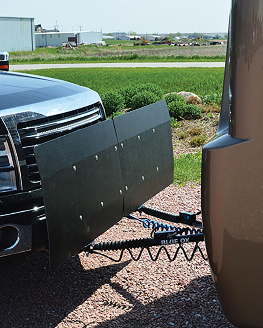 Blue Ox KarGard Protective Shield displayed on a car and trailer