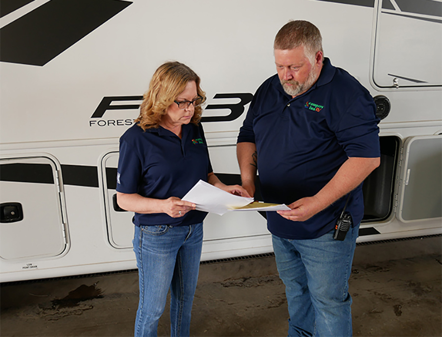 Jolene Dunithan and Dale Kidd looking at pending schedules