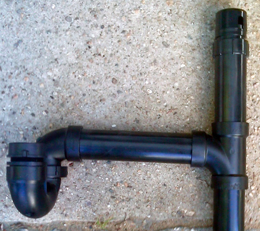 Here is a removed sink drain assembly with a P-trap. The ASTVD can be seen here as well