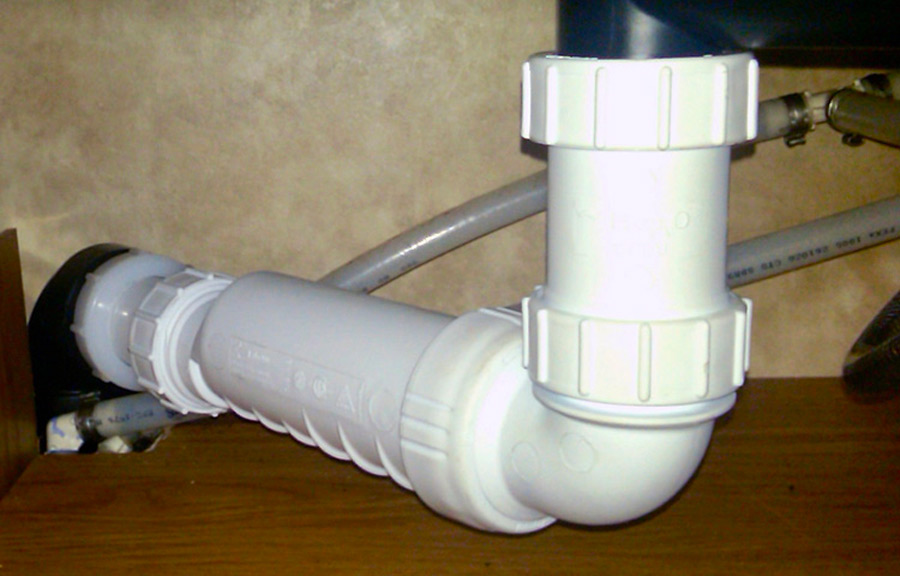 The above P-trap assembly has been replaced with this HEPvO waterless trap valve. These are often installed under RV showers and washer drains.