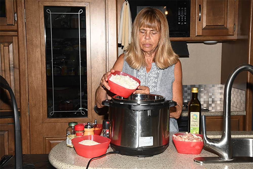 Woman using a multicooker