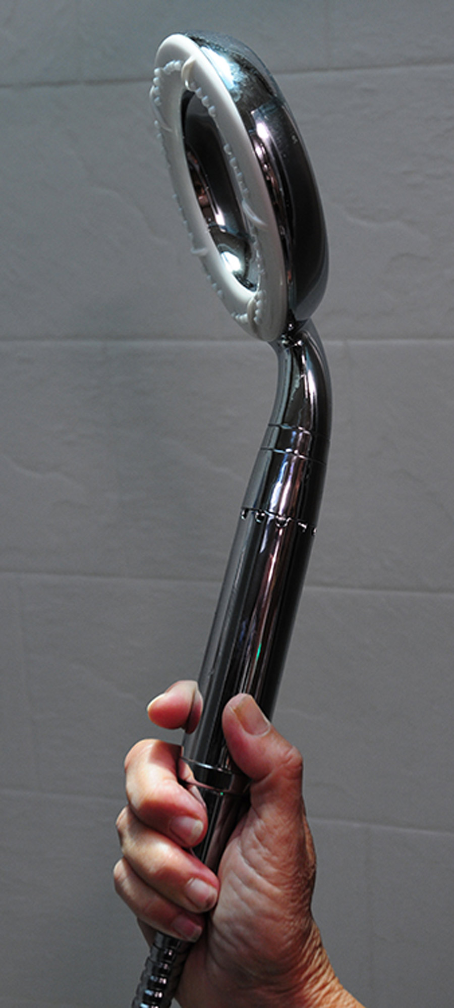 hand holding a shower head