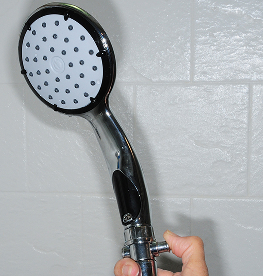 hand holding a shower head