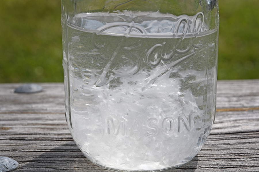 toilet paper in water in a mason jar