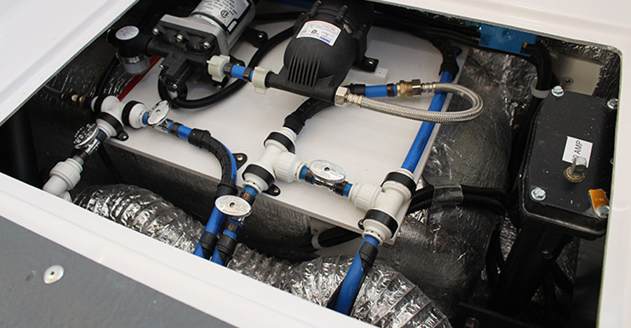 PTC fittings are so good that Oliver Travel Trailers uses them throughout its high-end fiberglass trailers as shown here, along with some standard brass crimp fittings