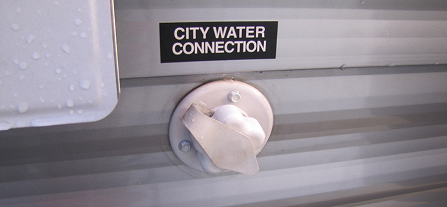 This fitting has a one-way flow valve from the outside and often has a hose, fittings and even a filter hanging from it