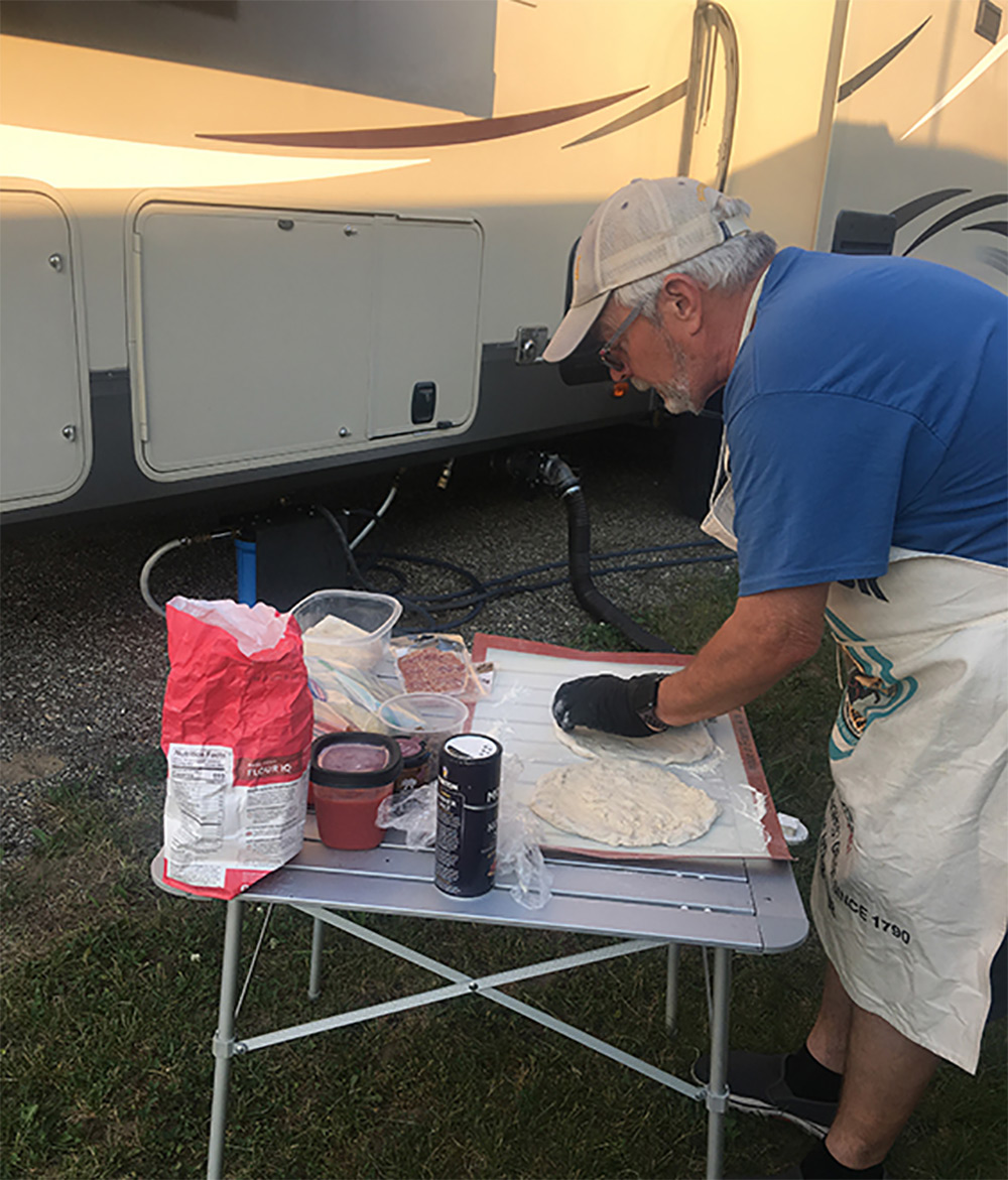 Jim Mac prepares pizzas