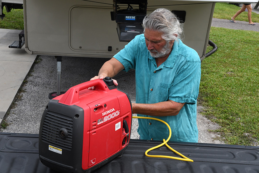 man working on RV generator