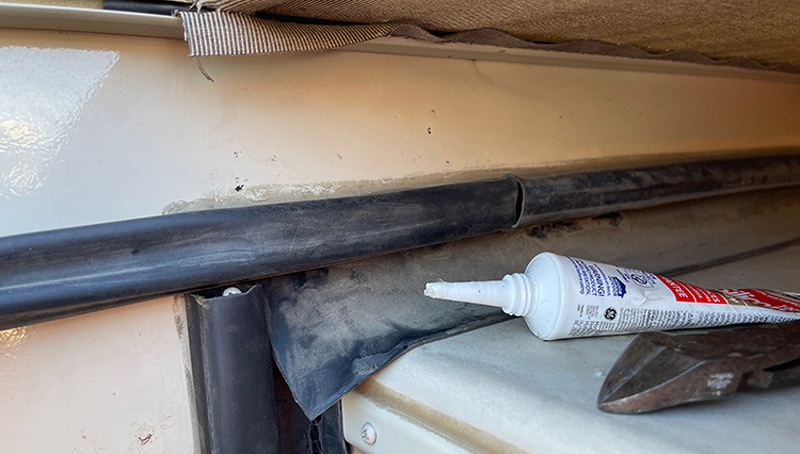 Clear silicone was applied on the edges of the H-track after driving screws into each end of the new bulb seal