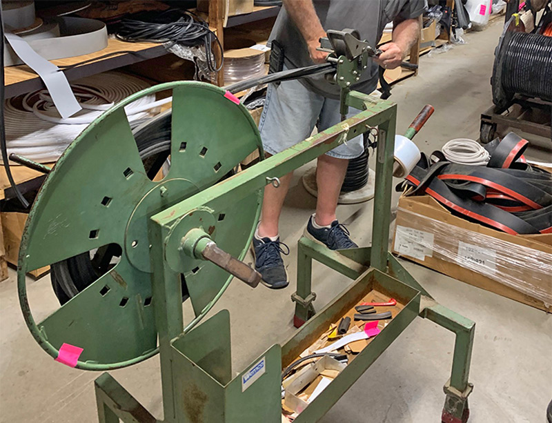 Once the correct bulb seal was located on the shelf, 40 feet of material were rolled off the spool and into a length counter