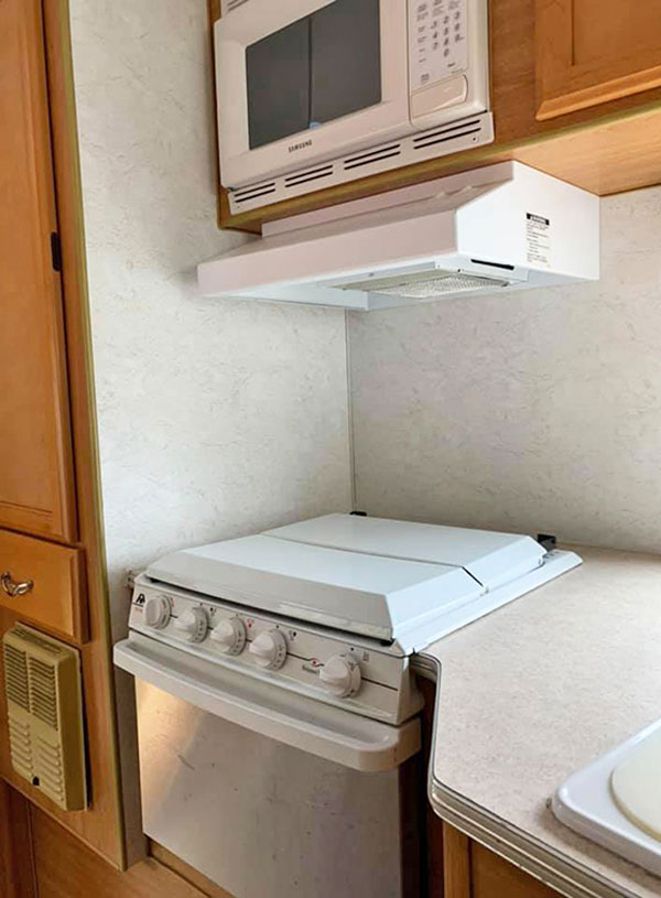 The old galley in our 2005 Lance Lite was serviceable — but barely — and was worn and dated