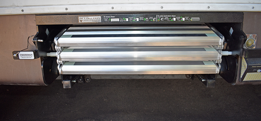 When folded for travel, steps are neatly tucked into the well under the entry door