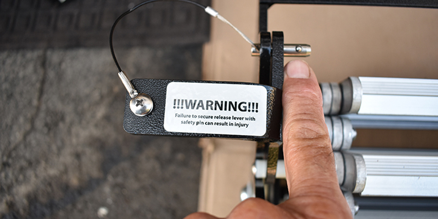 a pin prevents the steps from unfolding while in storage/travel mode