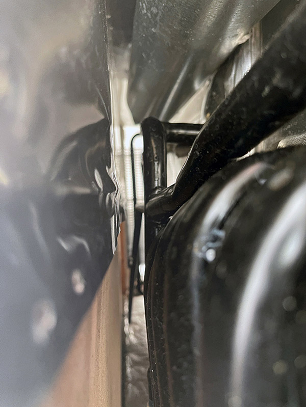 Using the camera on an iPhone, we were able to shoot up the back of the fridge