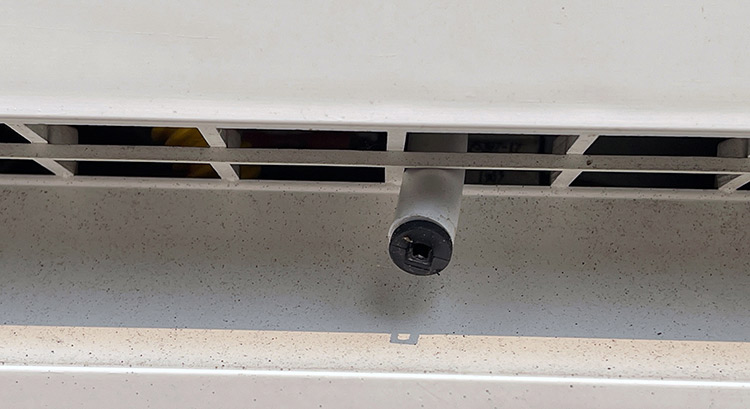 On this refrigerator, the condensate drain from the fresh food compartment drains into a tray on the back of the unit