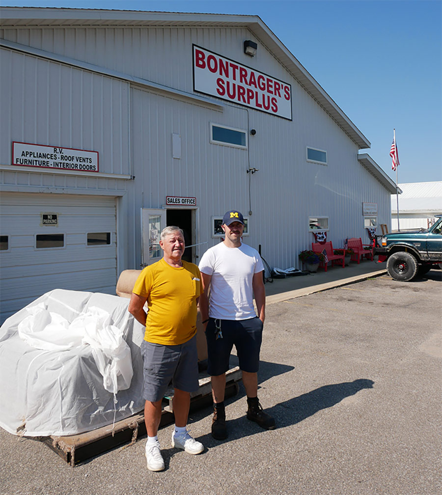Larry Bontrager and his son Skylar outside the company’s main parts building in White Pigeon, Michigan