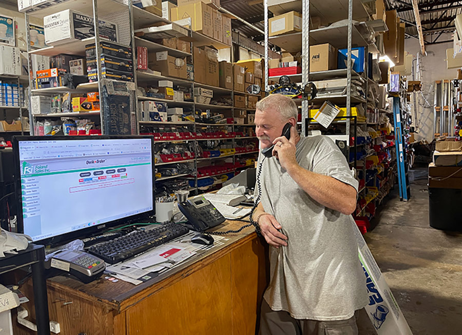 Owner Tim Christenson taking a phone part order