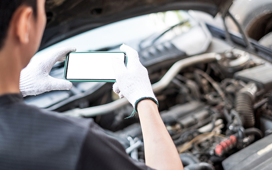 Man taking photo of engine