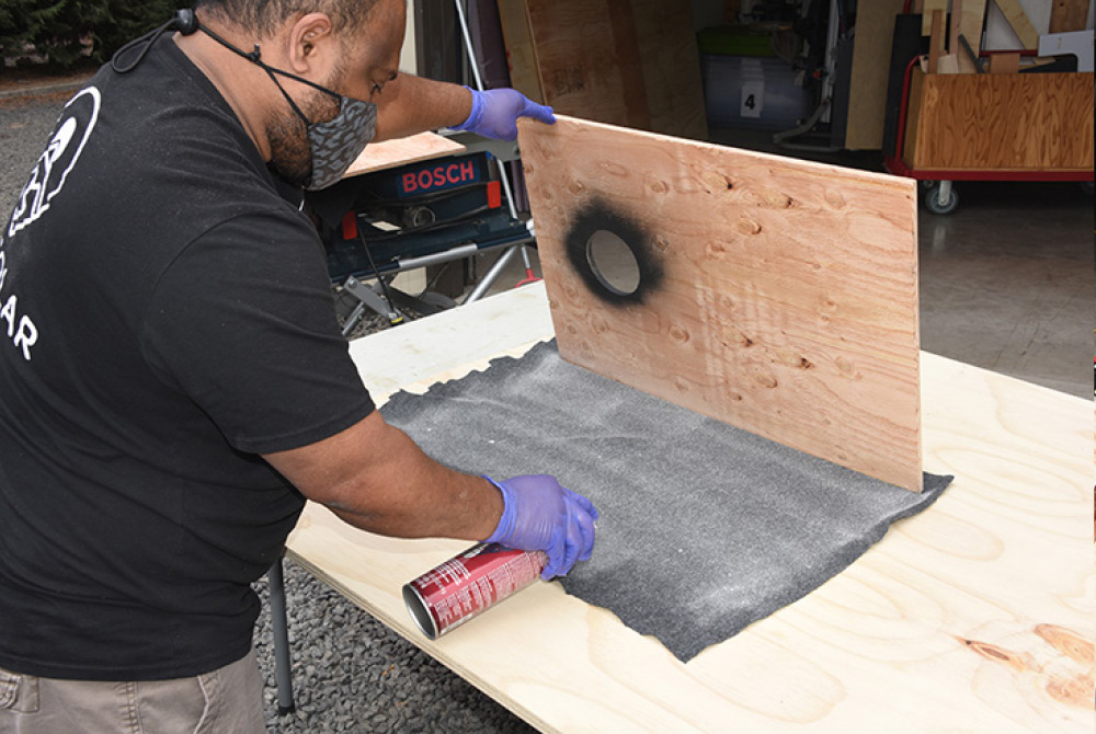 Flat black to reduce the visibility of light wood through the vent hole